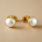 A pair of gold-plated 925 sterling silver cufflinks with mother of pearl inlays, displayed against a white background.